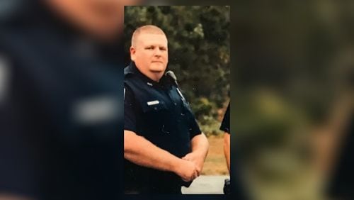 Polk County police Officer Andy Anderson was struck by a train Tuesday while chasing a burglary suspect on a railroad track in Rockmart.