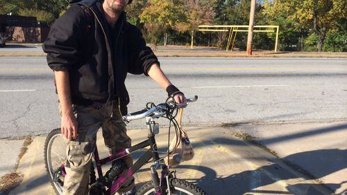 Christopher Popwell bikes 3 miles each way to his job in Hapeville. He got hit last year by a hit-and-run driver. By BILL TORPY BTORPY@AJC.COM