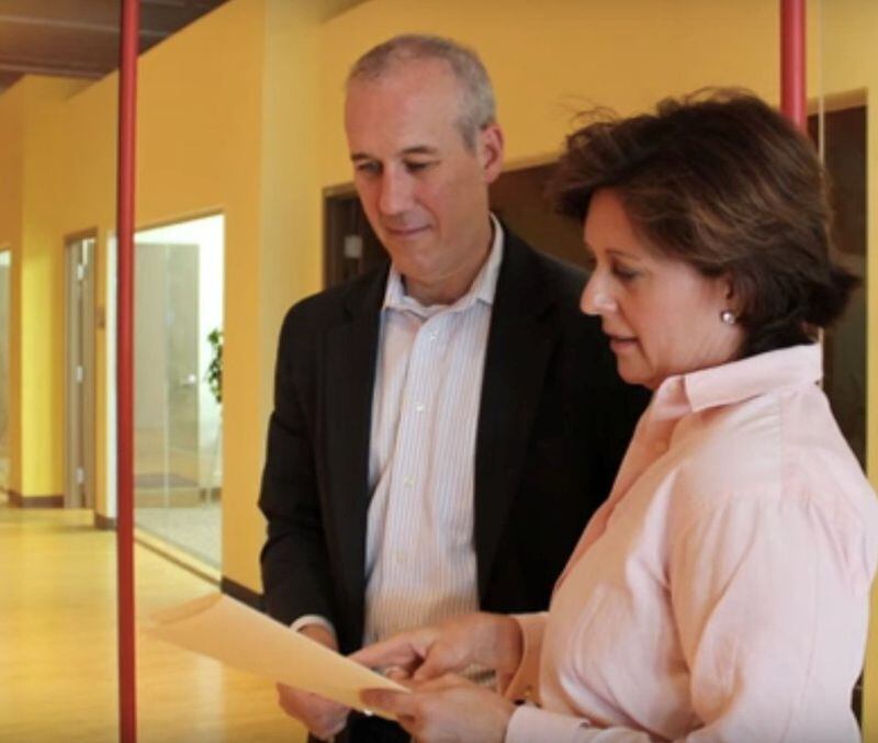 Lisa Earle McLeod confers with client Steve McHale, CEO of Explorys. McLeod used her Noble Purpose methodology to help Explorys focus on customers. CONTRIBUTED