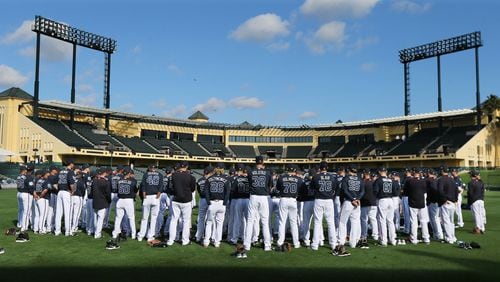 The entire Braves squad gathers in center field to begin a day of spring training at Disney’s ESPN Wide World of Sports complex last February. (Curtis Compton / ccompton@ajc.com)