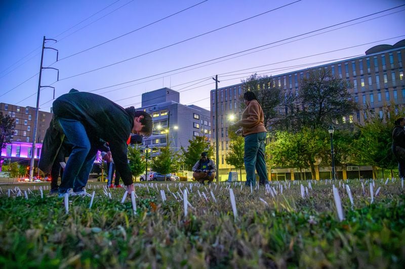 Protesters plant 460 forks in the ground outside of the closed Atlanta Medical Center on this, the anniversary of it's closing. November 1, 2023 (Jamie Spaar for the Atlanta Journal Constitution)