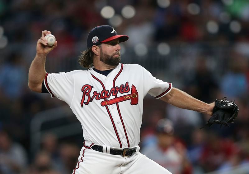 Braves starting pitcher R.A. Dickey works against the Washington Nationals. (AP Photo/John Bazemore)
