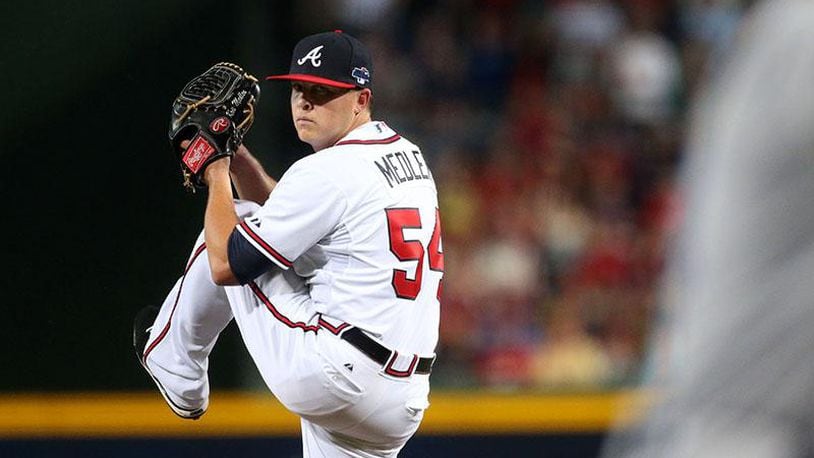 Kris Medlen is working his way up the Braves’ minor league system as he attempts his comeback from shoulder injuries that sidelined him for much of last season with the Royals. He had two Tommy John elbow surgeries during his years with the Braves through 2014. (AJC file photo)
