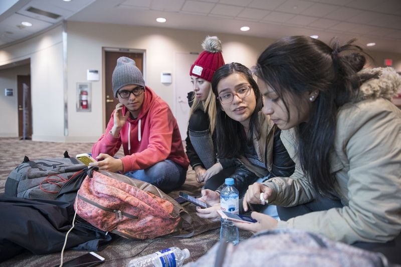 Peruvian exchange students (from left) Isreal Rodriguz, Alessa Carbonell, Antonella Linare and Kayla Velasquez, were marooned at Hartsfield-Jackson on Monday. The students are entering a work-study program in Oregon, once they get to Oregon. ALYSSA POINTER/ALYSSA.POINTER@AJC.COM