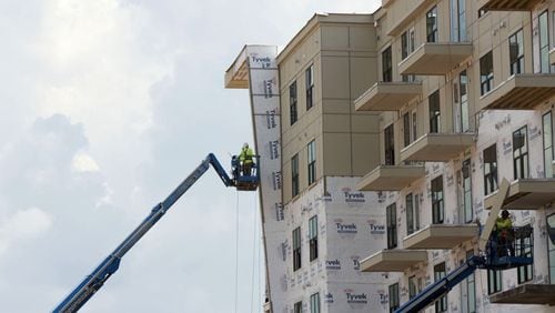 New multi-family housing rises in downtown Sandy Springs. The City Council has updated its development incentives to encourage the construction of affordable housing. AJC FILE