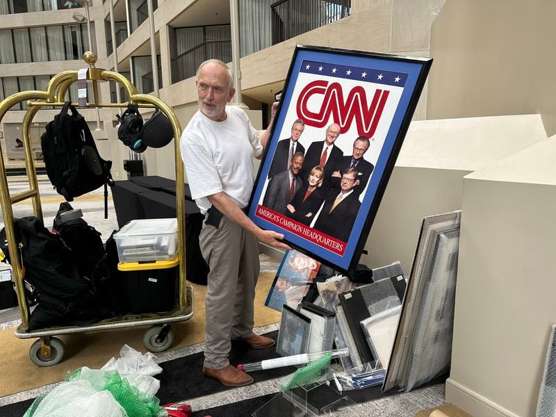 David Rust setting up his CNN history memorabilia mini-museum during the reunion reception on June 1, 2023, at CNN Center to bid farewell to the location as CNN employees move to the Techwood campus. RODNEY HO/rho@ajc.com
