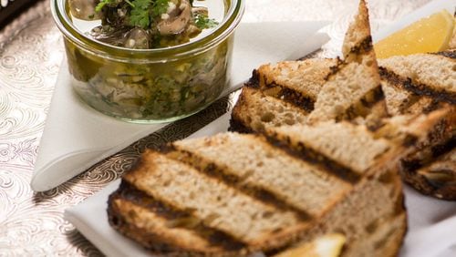 Grilled Oysters Meuniere with grilled toast and lemon. Photo Credit- Mia Yakel.