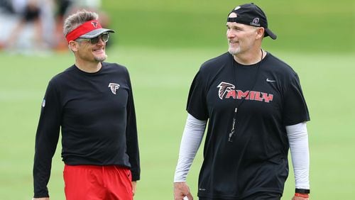 Atlanta Falcons general manager Thomas Dimitroff and head coach Dan Quinn observe player drills during the final day of mandatory minicamp Thursday, June 14, 2018, in Flowery Branch.