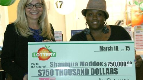 Georgia Lottery President and CEO Debbie Alford presented Atlanta winner Shaniqua Maddox with an oversized check for $750,000 Wednesday at Georgia Lottery headquarters in Atlanta.