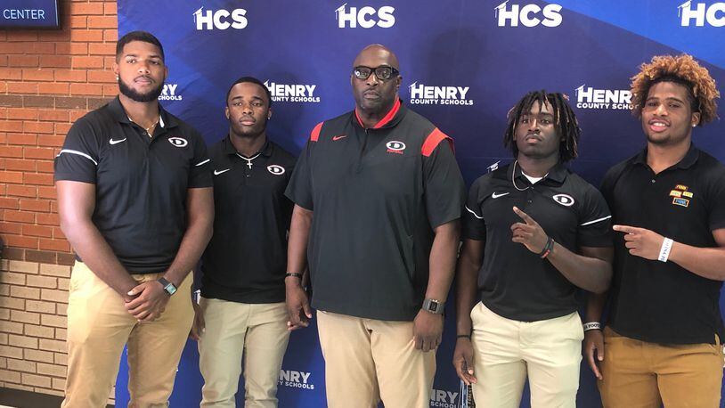 First-year Dutchtown coach Niketa Battle with four of his top players for the 2022 season -- D.J. Johnson, Jamal Bing, Hector Cari and Amarion Yarbough.