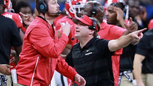 Jan. 01, 2019 New Orleans: Georgia assistant coach outside linebackers Dan Lanning and head coach Kirby Smart call the defense against Texas during the second half in the Allstate Sugar Bowl at Mercedes-Benz Superdome on Tuesday,  Jan. 1, 2019, in New Orleans.    Curtis Compton/ccompton@ajc.com