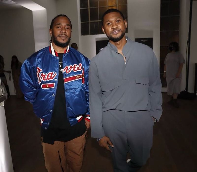 Former LaFace Records vice president of A&R Kawan "K.P." Prather and Usher pose backstage at a show.
(Courtesy of Johnny Nunez)