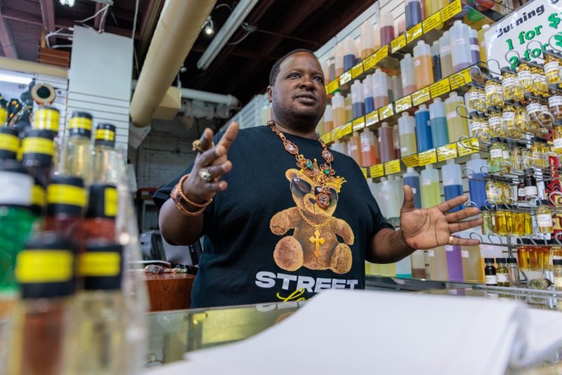 Mugaisi “Gai” Andega, manager of Afro-Centric Network in Atlanta’s West End, speaks to a reporter on Tuesday, August 9, 2022. (Arvin Temkar / arvin.temkar@ajc.com)