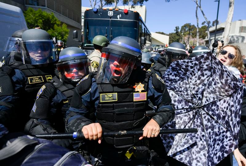 California Highway Patrol officers clash with protesters at UC San Diego Monday, May 6, 2024, in San Diego. Police cleared a campus Pro-Palestinian encampment in the early morning Monday. (AP Photo/Denis Poroy)