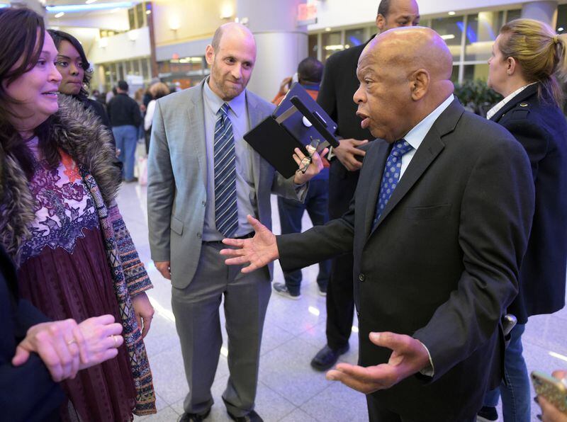 JANUARY 28, 2017  ATLANTA U.S. Congressman John Lewis (D-Ga, right) speaks with attorneys Sarah Owings and Daniel Werner outside the Customs and Border Protection office at Hartsfield Jackson International airport Saturday January 25, 2017 after at least 4 people were detained earlier today after an executive order from President Trump limited immigration into the United States. Kent D. Johnson/AJC