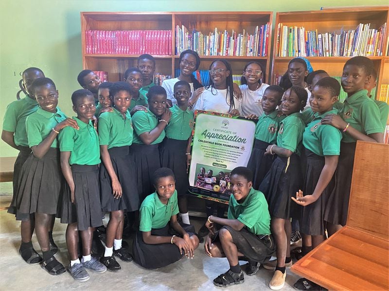 Child2Child founders with students of Tarkwa Breman Girls' School during their trip to Ghana over the summer. In back, from left, are: Sedinam Asase 16, Azzarrée Uwhubetine 17, Amirrah Uwhubetine 16, Eline Asase,15. Photo courtesy of the Child2Child Book Foundation.