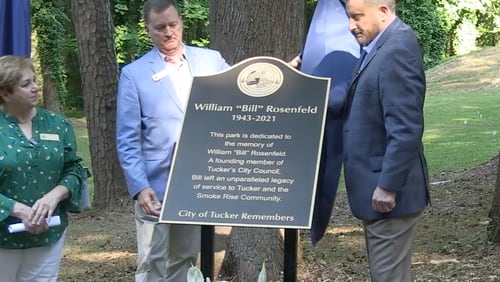 Councilwoman Pat Soltys (left), Mayor Frank Auman (center) and Corey Rosenfeld (right) unveiled a plaque in the newly named William "Bill" Rosenfeld Park on May 28.