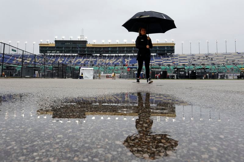 Water pools near the garage area as rain delays a NASCAR Cup Series auto race at Kansas Speedway in Kansas City, Kan., Sunday, May 5, 2024. (AP Photo/Colin E. Braley)
