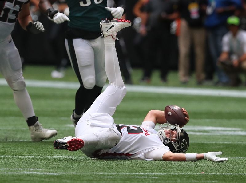 Falcons quarterback Matt Ryan is knocked to the turf on a sack by the Philadelphia Eagles during the second half Sunday, Sept 12, 2021, at Mercedes-Benz Stadium in Atlanta. (Curtis Compton / Curtis.Compton@ajc.com)