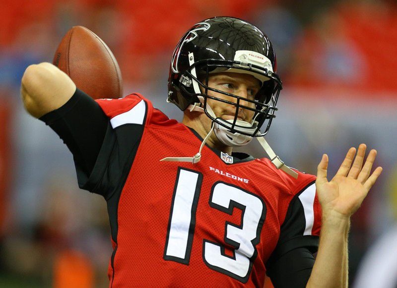 Falcons quarterback T.J. Yates gets loose before a 2014 game in Atlanta. (CURTIS COMPTON / AJC)