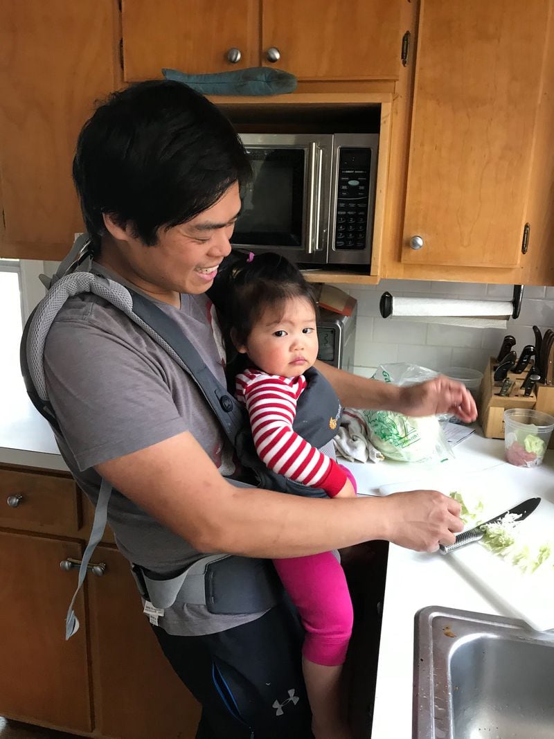 Chef Ron Hsu of Lazy Betty cooking with his daughter, Calliope.