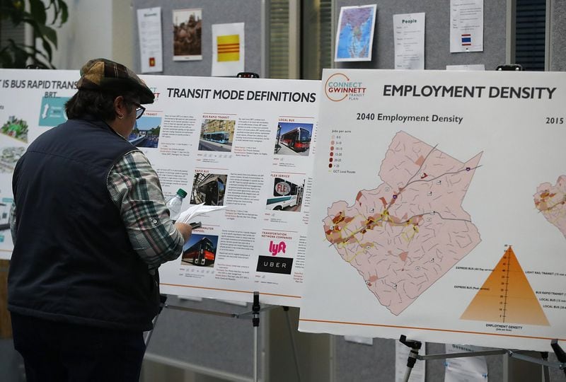 Nancy Dyer of Norcross looks at displays during a Gwinnett County public information session on its proposed transit plan. The event took place at the Gwinnett Justice and Administrative Center in Lawrenceville on April 25, 2018. 