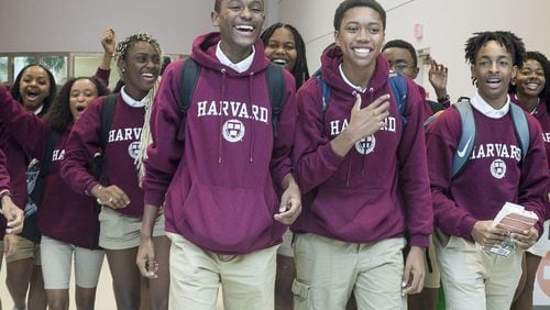 7/12/2019 — Atlanta, Georgia — Members of the Harvard Diversity Project react as their family, friends and supporters greet them at the domestic terminal at Hartsfield Jackson International Airport in Atlanta, Friday, July 12, 2019. The group, an Atlanta-based pipeline of the Harvard Debate Council, returned to Atlanta as champions of Harvard University’s annual international debate tournament. Two of the students, Don Jr. Roman (fourth from left) and Keith Harris (third from right) achieved an unprecedented, undefeated record. (Alyssa Pointer/alyssa.pointer@ajc.com)