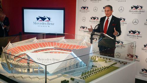 AUGUST 24, 2015 ATLANTA Arthur Blank reveals the stadium name during the press conference. Atlanta Falcons team owner Arthur Blank and Stephen Cannon, president and CEO of MBUSA, hold a press conference announcing a deal for the naming rights for the New Falcons Stadium, Monday, August 24, 2015. The press conference was also attended by Georgia Governor Nathan Deal and Atlanta Mayor Kasim Reed. The agreement, which continues through 2042, includes official naming rights and other partnership benefits. The Mercedes-Benz brand will be prominent inside and outside the building, including on the roof; in plaza areas; on directional, on-field and tunnel signage; in club areas; in VIP parking and entrance areas; on the first-of-its-kind video halo board; and in additional areas. Financial terms of the agreement were not disclosed. KENT D. JOHNSON /KDJOHNSON@AJC.COM