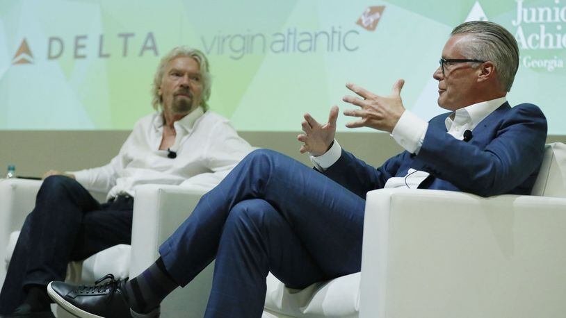 Delta CEO Ed Bastian (right) and Virgin founder Richard Branson held a “fireside chat” event at the GWCC where they discussed the partnership between Delta and Virgin Atlantic and their goal of transforming the customer experience. BOB ANDRES /BANDRES@AJC.COM