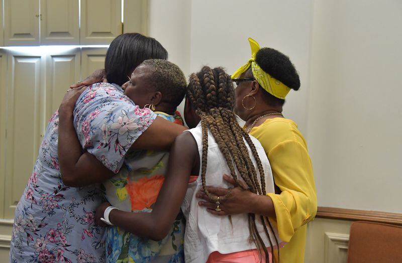 Family members of Timothy Coggins embrace after the murder trial of Franklin Gebhardt at the Spalding County Courthouse on Tuesday, June 26, 2018. The 60-year-old defendant - labeled a racist by his own lawyer - will spend the rest of his life behind bars for the 1983 crime. Franklin Gebhardt was charged with killing 23-year-old Timothy Coggins, stabbing him 30 times and dragging his body behind a pickup truck. 