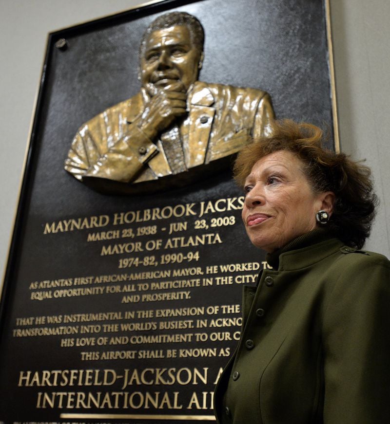 Valarie Jackson stands next to the newly unveiled plaque of her late husband, Maynard H. Jackson Jr. When the airport’s terminal was built in the 1970s, Mayor Jackson determined that minorities should get 25 percent of the total contract dollars. 