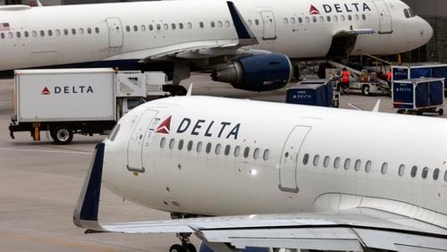 A Delta Air Lines plane leaves the gate on July 12, 2021, at Logan International Airport in Boston. (Michael Dwyer/AP)