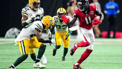 Falcons wide receiver Julio Jones runs with the ball during the first half against the Packers  Sunday night at Mercedes-Benz Stadium in Atlanta.