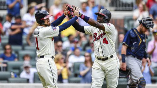 Atlanta Braves second baseman Brandon Phillips, right, high-fives Ender Inciarte, left, after hitting a two-run home run during the third inning of the team's baseball game against the Milwaukee Brewers on Saturday, June 24, 2017, in Atlanta. Keeping up with the Braves and other Atlanta teams just got easier. Follow @ajc_sports on Instagram for news, photos, and videos of your favorite teams. (AP Photo/Danny Karnik)