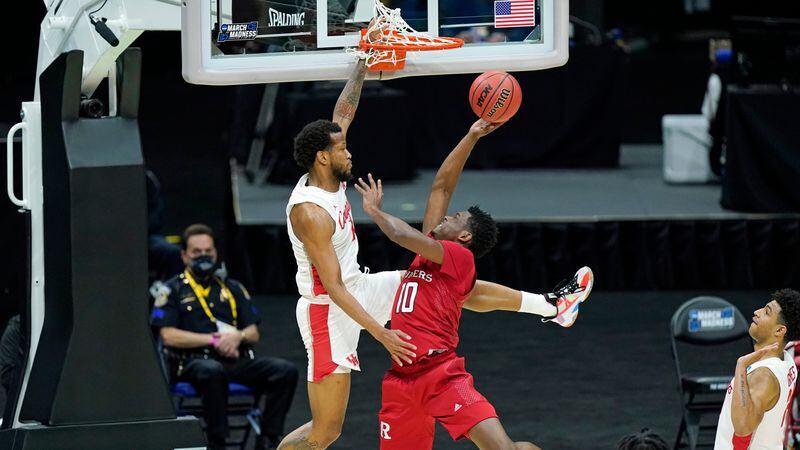 Rutgers' Montez Mathis (10) drives against Houston's Justin Gorham (left) during the first half of their second-round game of the NCAA Tournament Sunday, March 21, 2021, at Lucas Oil Stadium in Indianapolis. (Mark Humphrey/AP)