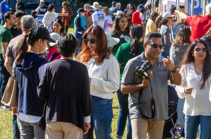 People walk around the vendor tends during the Johns Creek International Festival on October 23, 2021. STEVE SCHAEFER FOR THE ATLANTA JOURNAL-CONSTITUTION