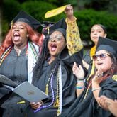 Graduates cheer on their classmates during Oglethorpe University's Class of 2022 commencement ceremony Saturday, May 21, 2022. (Steve Schaefer / steve.schaefer@ajc.com)