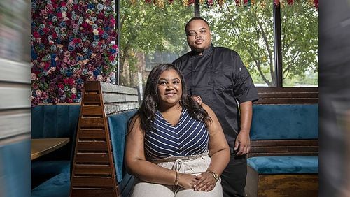 Jessica Booth, owner of Chef’d Up, and executive chef Robert Butts (right) pose for a photo at the restaurant in Atlanta’s Old Fourth Ward community, Friday, May 29, 2020.