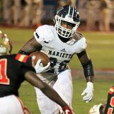 Marietta's Kimani Vidal runs the ball down field toward Rome's Trey Lawrence during the second quarter of Thursday's 2020 game at Barron Stadium in Rome. Vidal was a three-star prospect ranked as the consensus No. 949 prospect out of high school after he rushed for more than 1,000 yards for a Class 7A championship team. The Los Angeles Chargers selected him in the sixth round, No. 181 overall, in the 2024 NFL Draft. (Jeremy Stewart/Special)