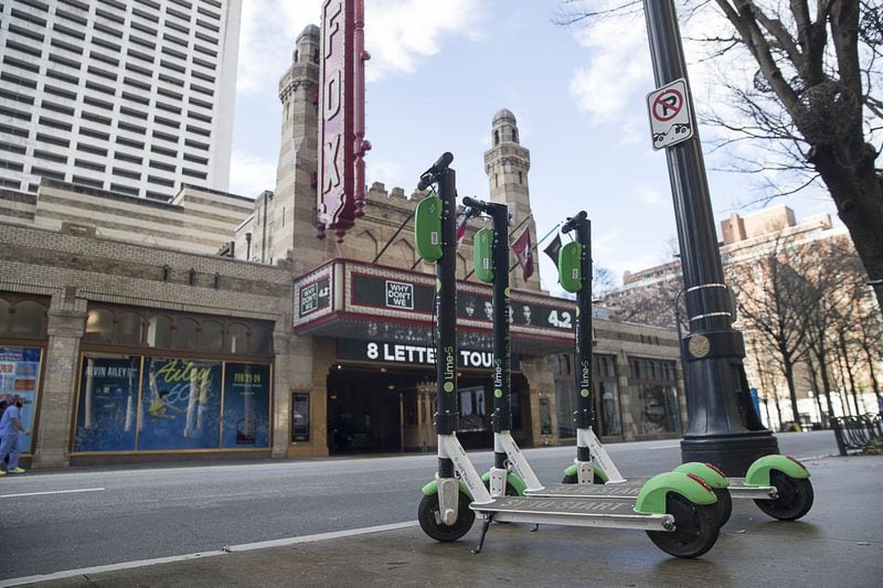  Lime Scooters are parked on the sidewalk across the street from The Fox Theater in Atlanta’s Midtown community, Friday, January 4, 2019. (ALYSSA POINTER/ALYSSA.POINTER@AJC.COM)