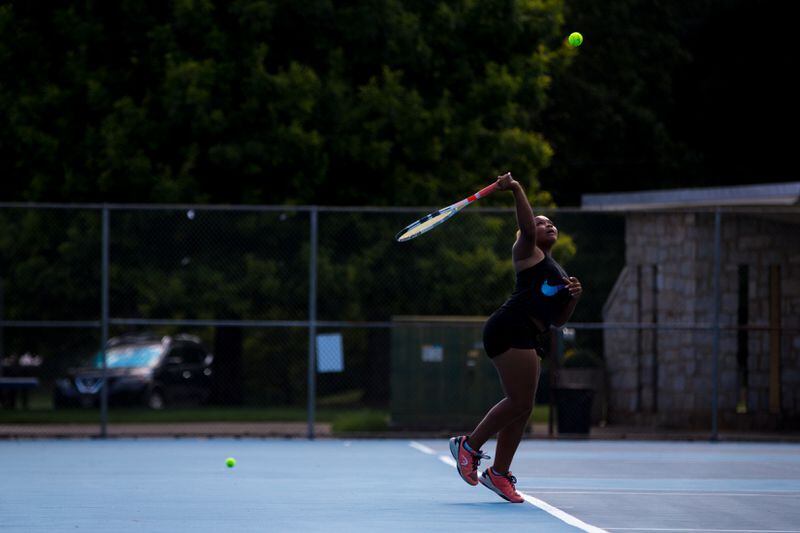 Telain Bivins, 16, hits the ball while playing in a USTA sanctioned tennis match at Sharon Lester Tennis Center in Atlanta, Ga., on Friday, June 28, 2019. (Casey Sykes for The Atlanta Journal-Constitution)