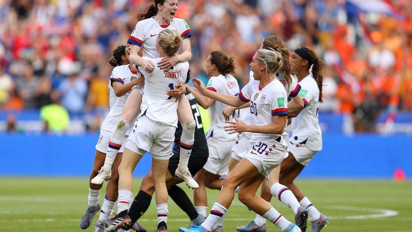 LYON, FRANCE - JULY 07:  Rose Lavelle of the USA celebrates with Emily Sonnett of the USA and teammates at full-time after winning the 2019 FIFA Women's World Cup France Final match between The United States of America and The Netherlands at Stade de Lyon on July 07, 2019 in Lyon, France. (Photo by Richard Heathcote/Getty Images)