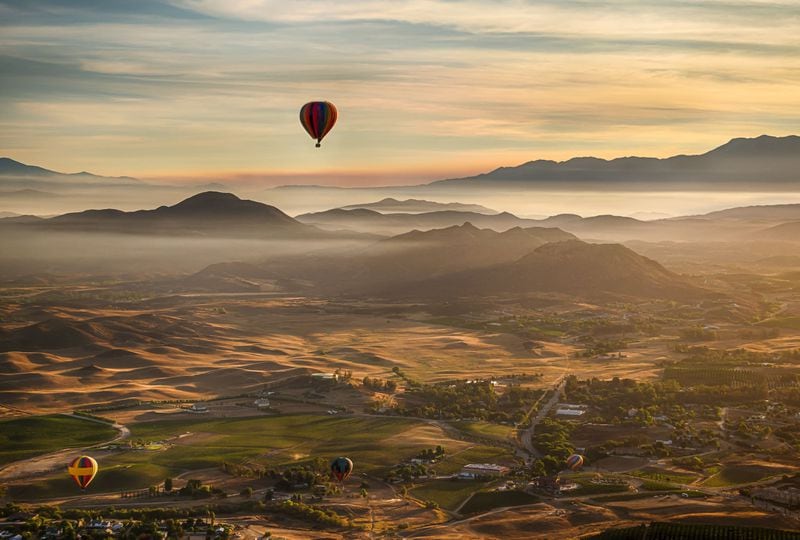 View Temecula Valley’s lakes, citrus groves, wineries, estates, mountains and wildlife from above with a serene sunrise balloon ride. CONTRIBUTED BY COLIN MICHAELIS