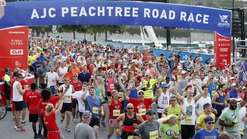 Racers begin at the starting line from Lenox Square during the 47th running of the AJC Peachtree Road Race Monday July 4, 2016, in Atlanta.
