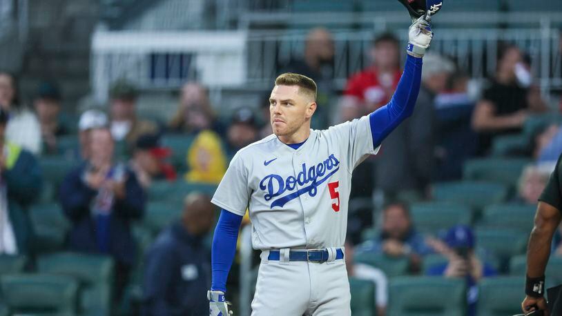 Former Atlanta Brave and current Los Angeles Dodger Freddie Freeman acknowledges fans before his first at bat at Truist Park, Monday, May 22, 2023, in Atlanta. (Jason Getz / Jason.Getz@ajc.com)
