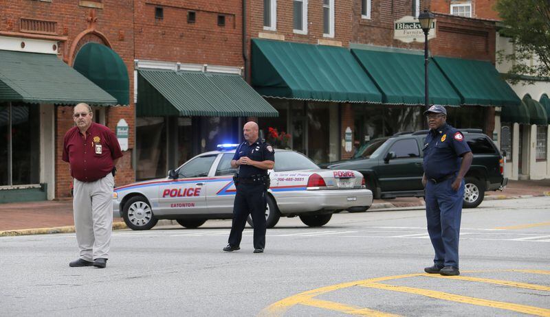 6/21/17 - Eatonton, GA - Security personnel stationed in the street near the courthouse wait for the prisoners to be transported back to jail. Ricky Dubose and Donnie Russell Rowe, captured fugitives accused of killing two prison guards, had their first appearance in Putnam County Court this morning. BOB ANDRES /BANDRES@AJC.COM