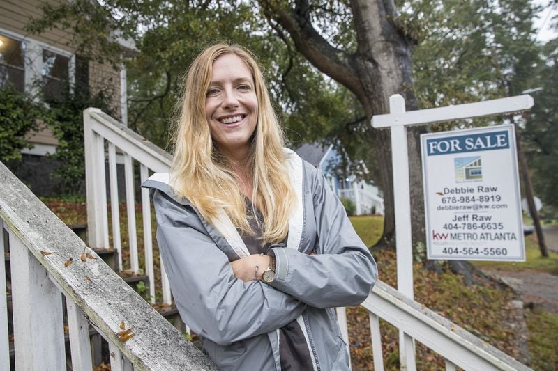 Kim Wachtel, real estate broker, outside of her newly purchased investment property in the Cascade Road community of Southwest Atlanta in October. (Alyssa Pointer/Atlanta Journal-Constitution)