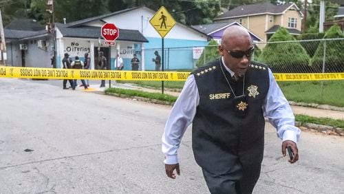 Clayton County Sheriff Victor Hill leaves the scene in northwest Atlanta where a man sought by law enforcement officers killed himself on July 10, 2019. (Credit: JOHN SPINK / AJC)