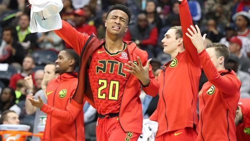 Hawks forward John Collins leads the cheers off the bench against the Cavaliers in a game Thursday, November 30, 2017, in Atlanta.  Curtis Compton/ccompton@ajc.com