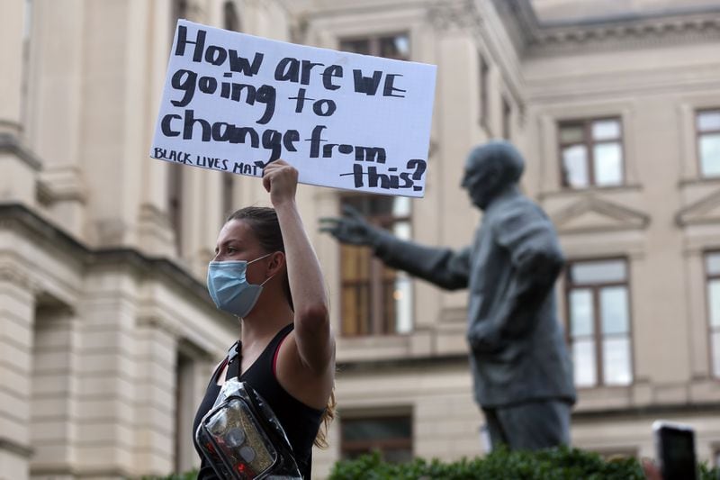 Sarah Hanson stands as protesters march from the Richard B. Russell Federal Building in downtown Atlanta to the Georgia State Capitol for March on Georgia, a protest hosted by the Georgia chapter for the NAACP, on Monday, June 15, 2020. (REBECCA WRIGHT FOR THE ATLANTA JOURNAL-CONSTITUTION)